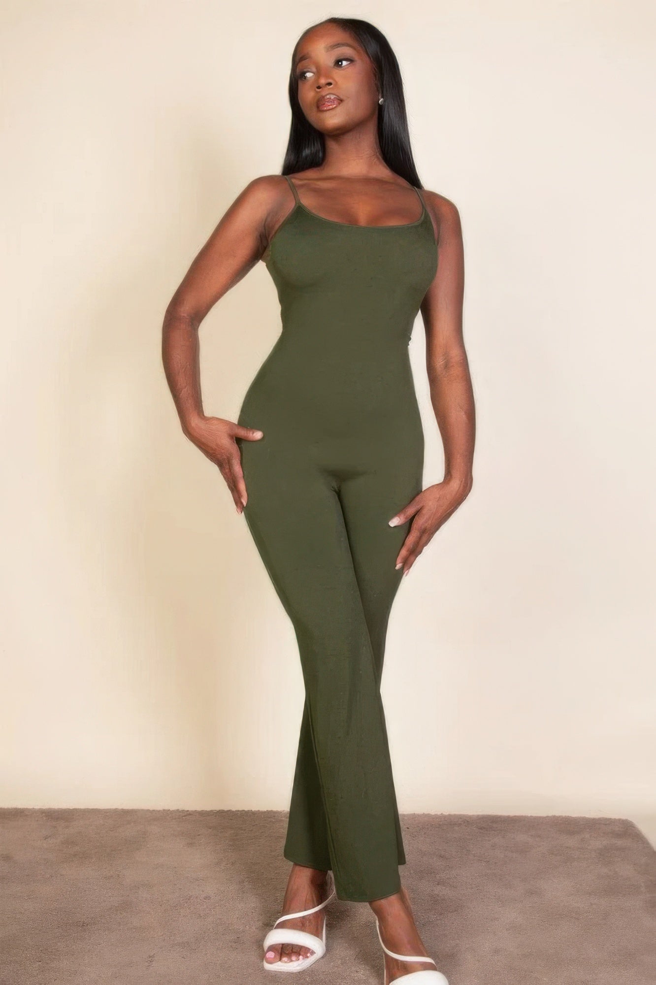 Ribbed sleeveless wide leg jumpsuit, this sophisticated piece features a soft, medium-weight rib knit fabric that provides a perfect blend of comfort and style