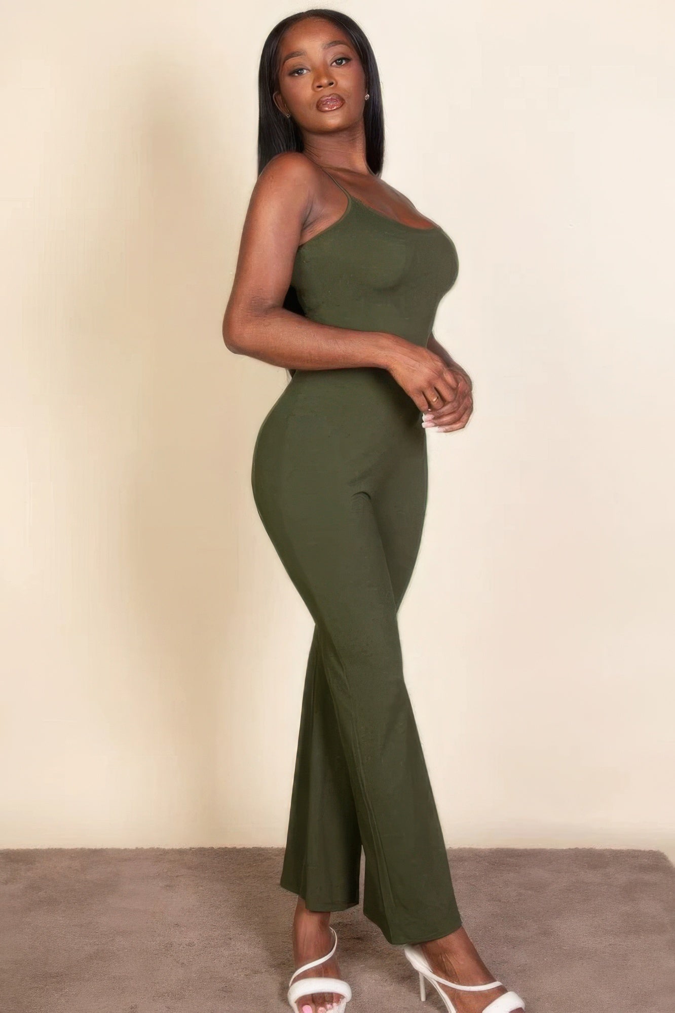 Ribbed sleeveless wide leg jumpsuit, this sophisticated piece features a soft, medium-weight rib knit fabric that provides a perfect blend of comfort and style