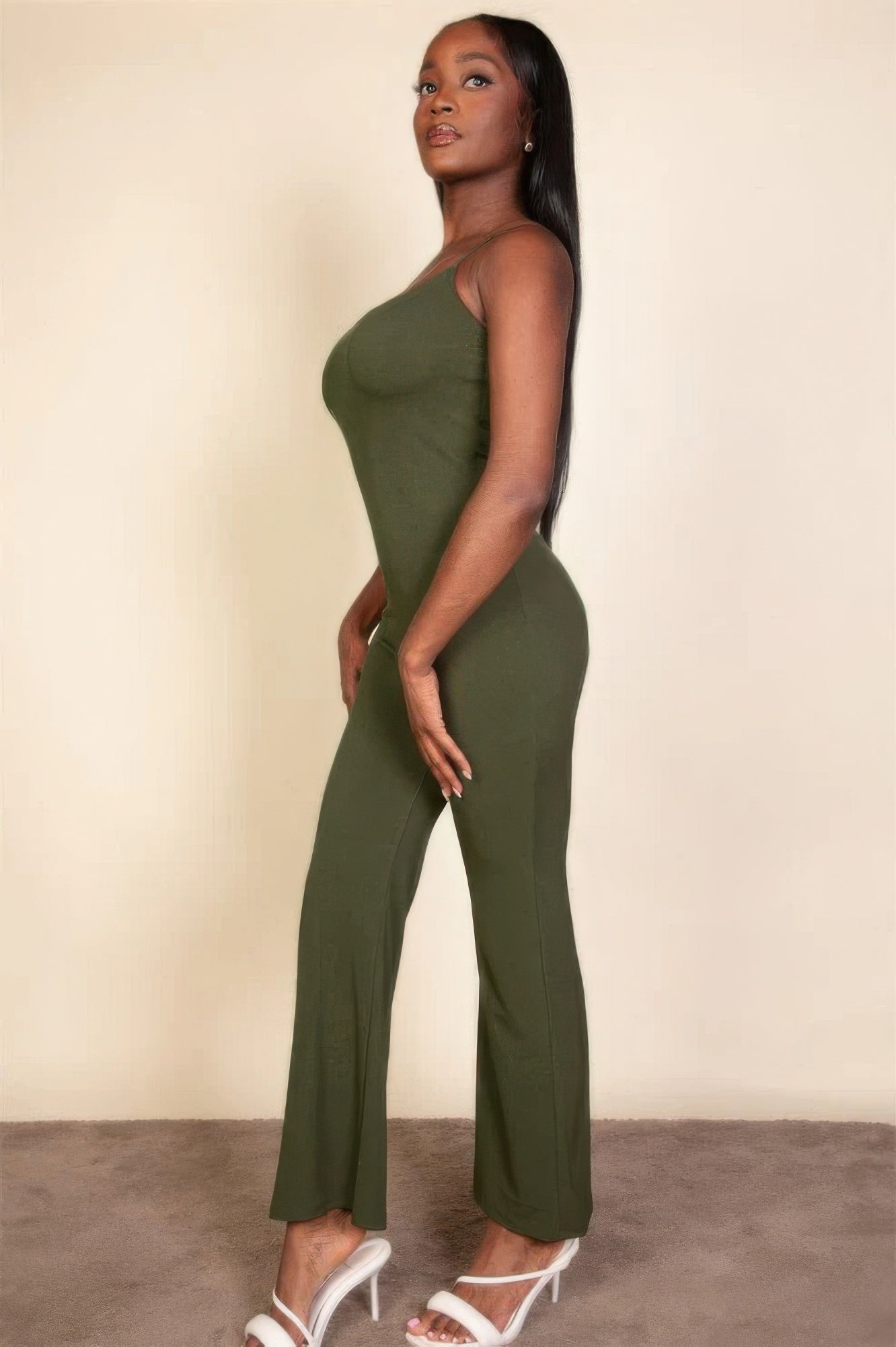 Ribbed sleeveless wide leg jumpsuit, this sophisticated piece features a soft, medium-weight rib knit fabric that provides a perfect blend of comfort and style