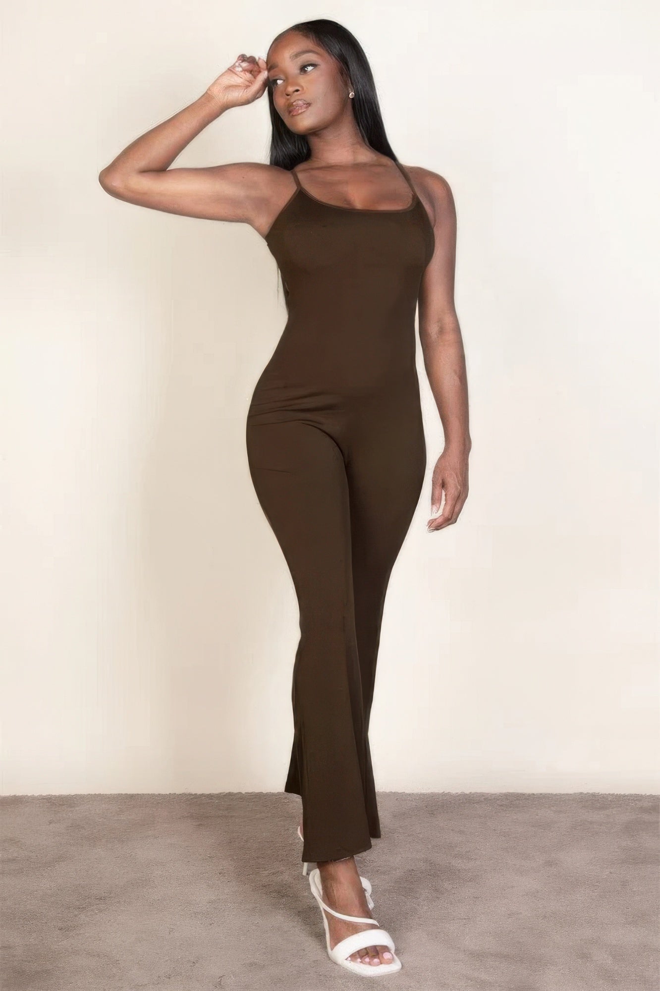 Ribbed sleeveless wide leg jumpsuit, this sophisticated piece features a soft, medium-weight rib knit fabric that provides a perfect blend of comfort and style