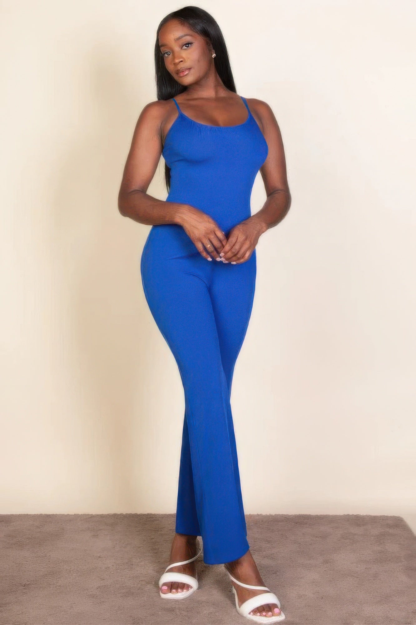 Ribbed sleeveless wide leg jumpsuit, this sophisticated piece features a soft, medium-weight rib knit fabric that provides a perfect blend of comfort and style