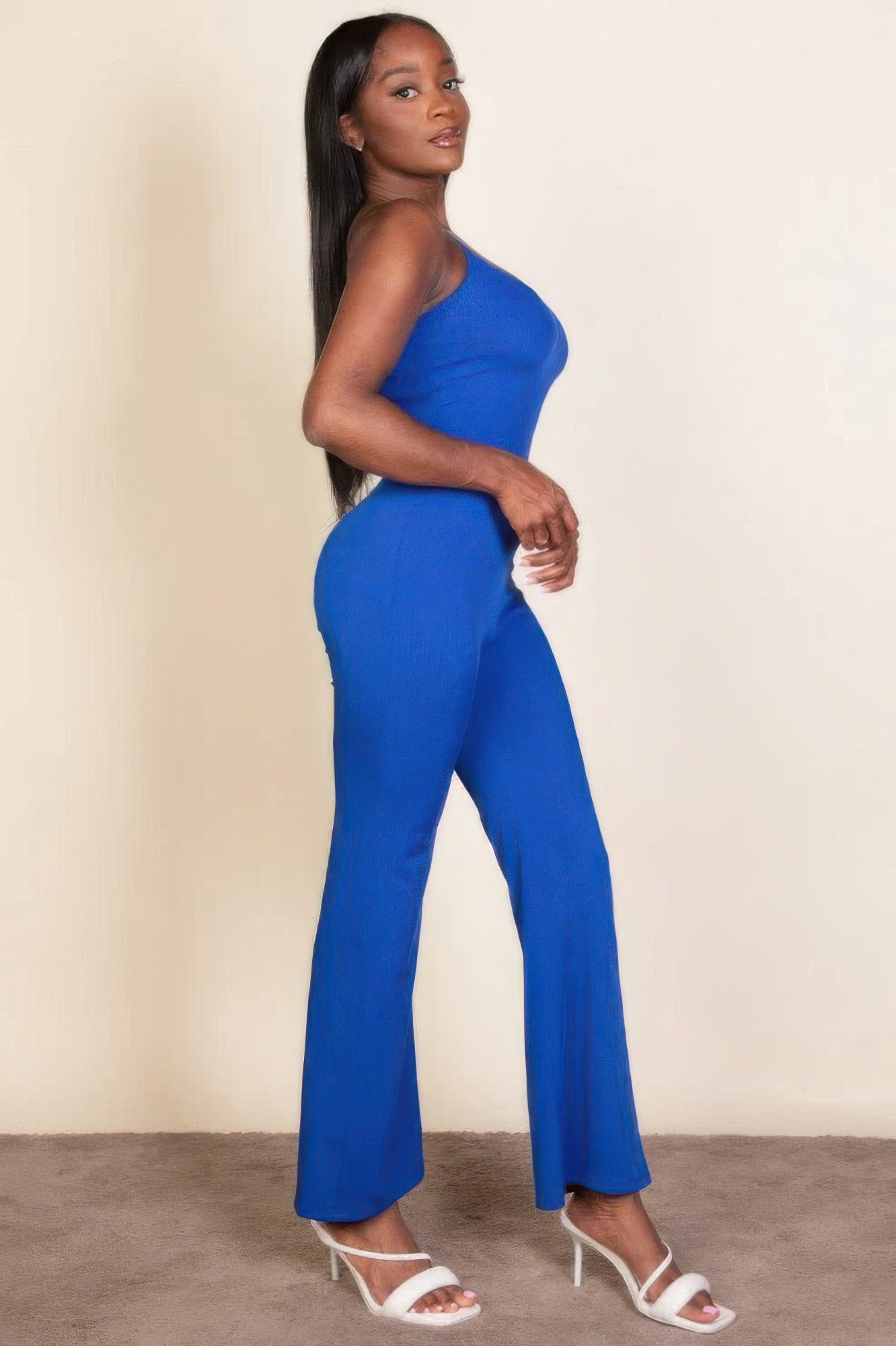 Ribbed sleeveless wide leg jumpsuit, this sophisticated piece features a soft, medium-weight rib knit fabric that provides a perfect blend of comfort and style