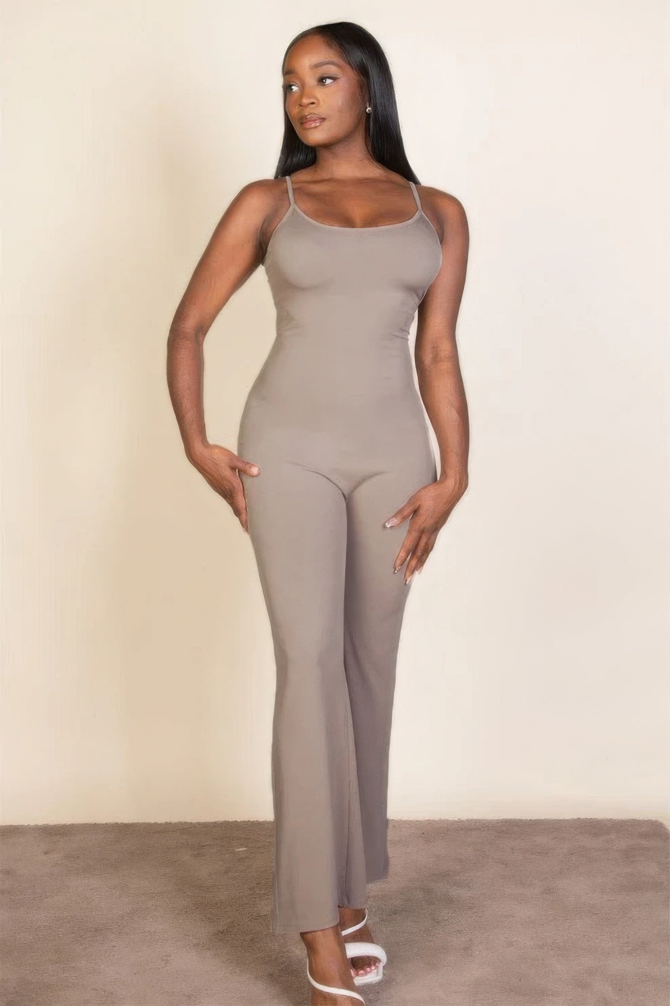 Ribbed sleeveless wide leg jumpsuit, this sophisticated piece features a soft, medium-weight rib knit fabric that provides a perfect blend of comfort and style