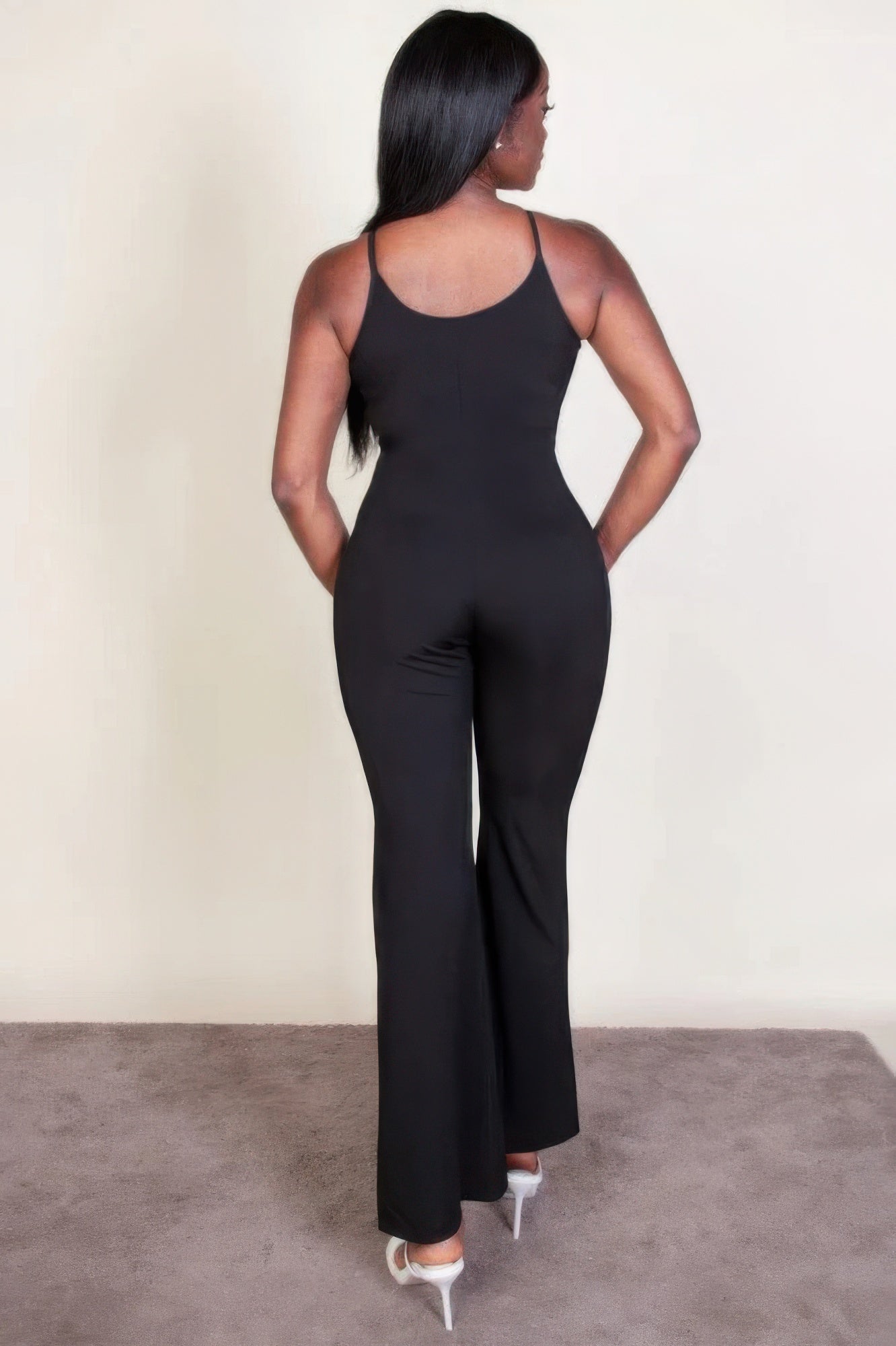 Ribbed sleeveless wide leg jumpsuit, this sophisticated piece features a soft, medium-weight rib knit fabric that provides a perfect blend of comfort and style